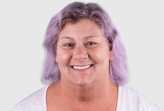 Smiling female patient showcasing the results of cosmetic and restorative dental treatment at Paradise Dentistry Cabo.