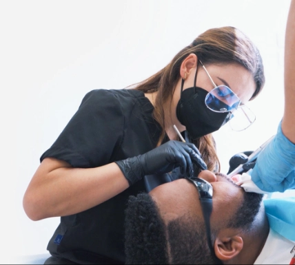 Female patient before cosmetic and restorative dental treatment at Paradise Dentistry Cabo, showing the smile prior to treatment.