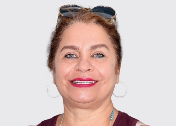 Smiling female patient showcasing the results of cosmetic and restorative dental treatment at Paradise Dentistry Cabo.